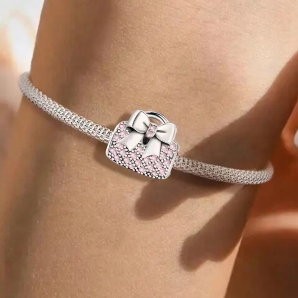 New silvertone bow pink crystal slider bead